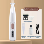 A white handheld LED pet groomer with buttons on the front, alongside accessories such as a small bottle and a USB cable, with dogs in the background indicating use for pets.