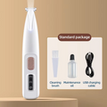 A white handheld LED pet groomer with buttons on the front, alongside accessories such as a small bottle and a USB cable, with dogs in the background indicating use for pets.