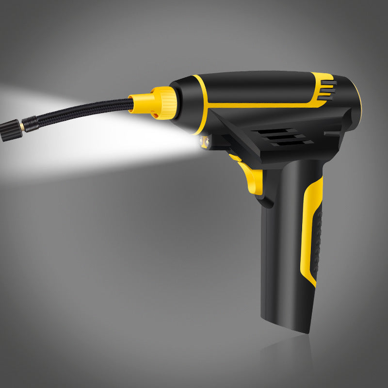 Black and yellow tire pressure  gun on a gray background
