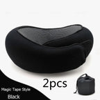Black neck massager with packaging on a white background