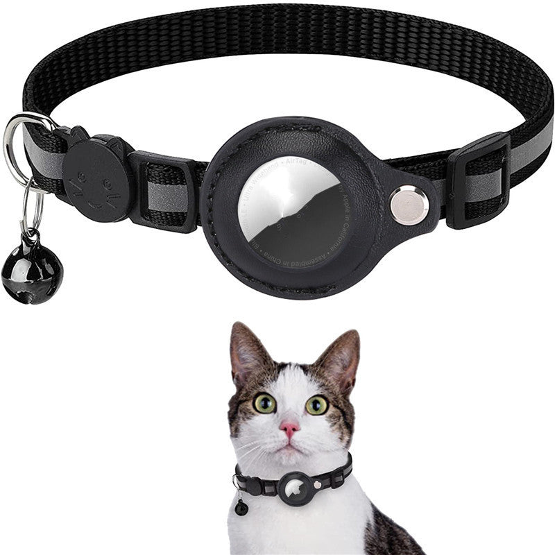 Black pet collar with a central circular window showing a cat silhouette, displayed above a photo of a cat wearing the same collar. The collar has reflective gray stripes, a small hanging bell, and a silver buckle.