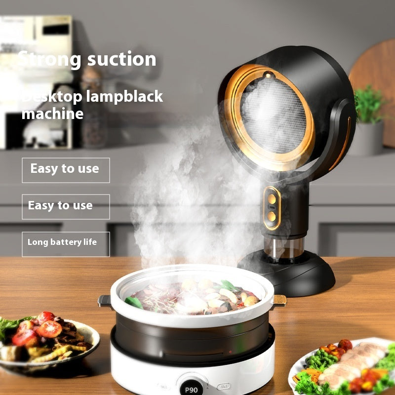 Desktop lampblack machine with food on a table in a kitchen setting