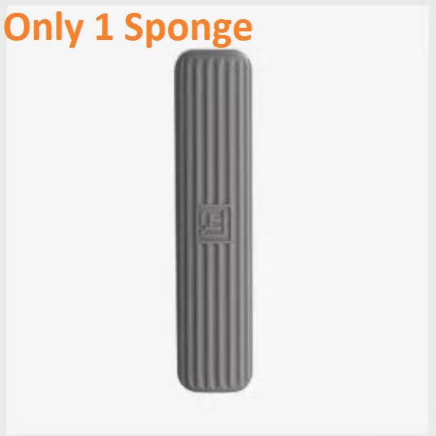 Gray sponge with a textured surface on a white background