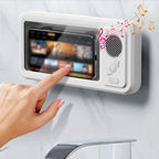 Hand interacting with a digital display on a wall-mounted device with music notes above it.