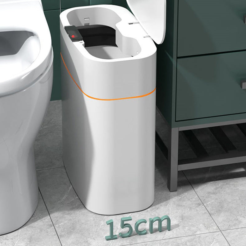 Modern toilet with a small additional unit next to it in a bathroom setting.