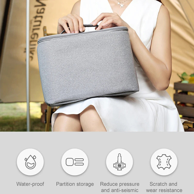 Person holding a gray bag with product features listed below