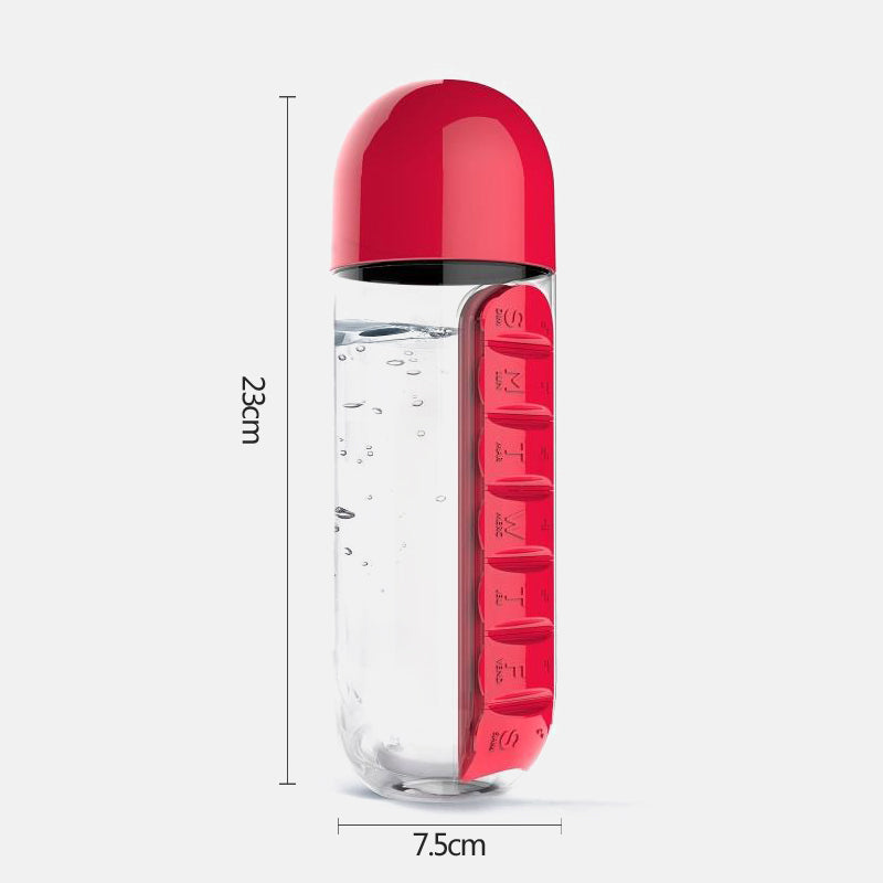 Red pill organizer with clear compartmentalized body on a white background