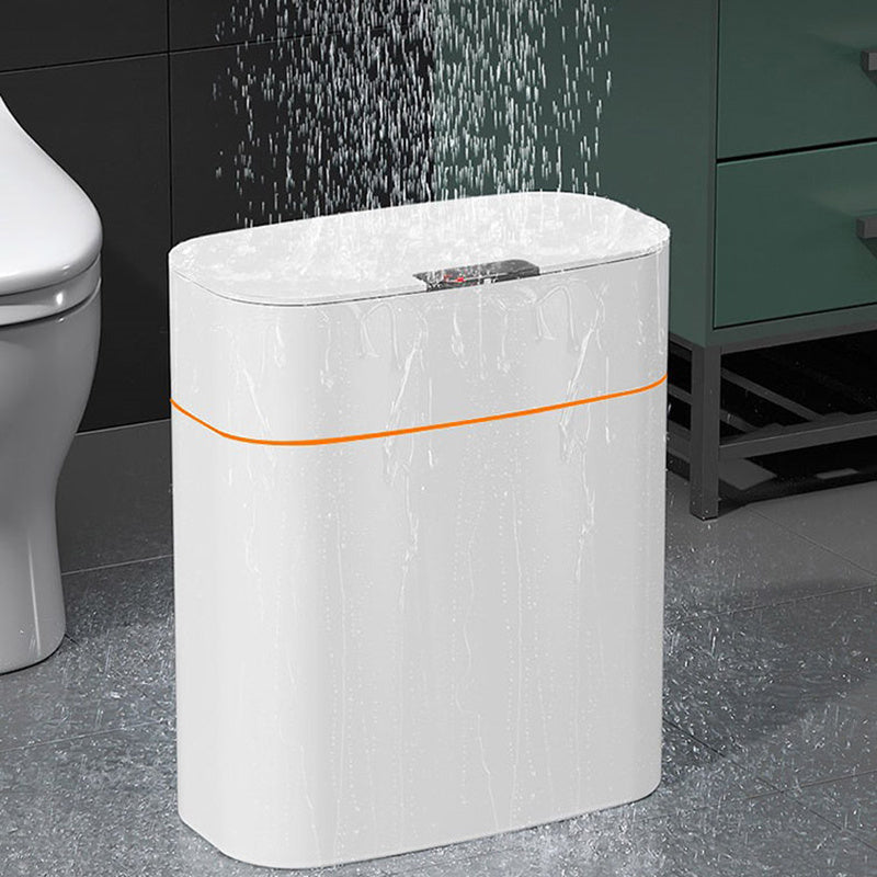 White cylindrical water heater with orange accent in a bathroom setting