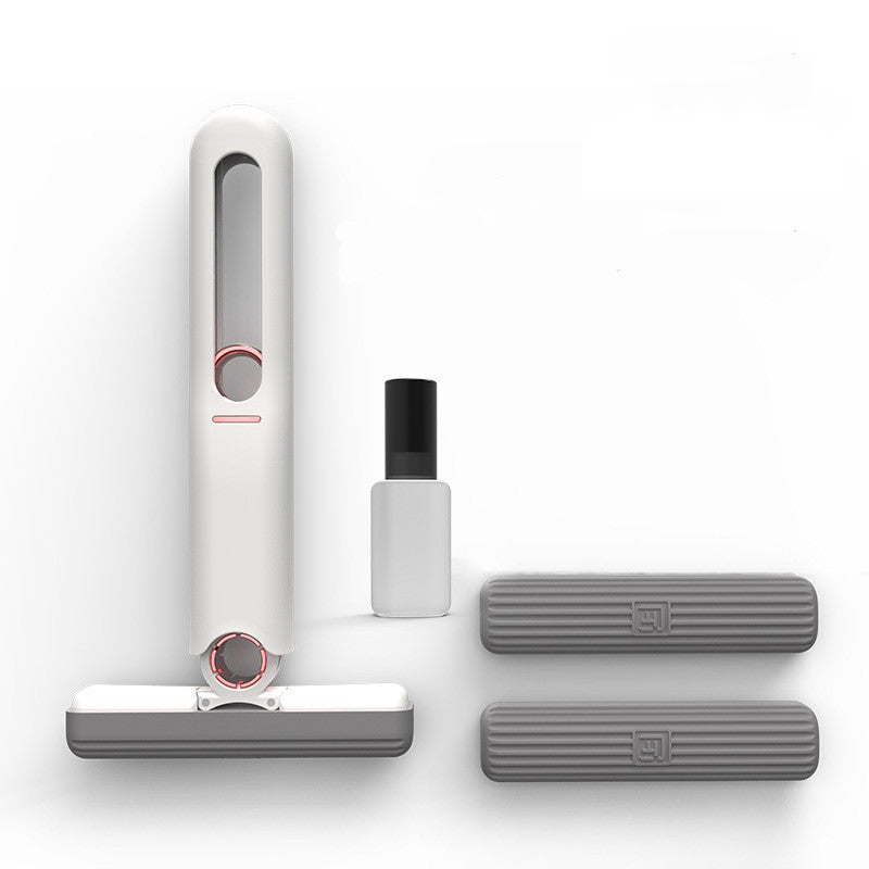 White handheld cleaner with attachments on a white background