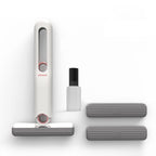 White handheld cleaner with attachments on a white background