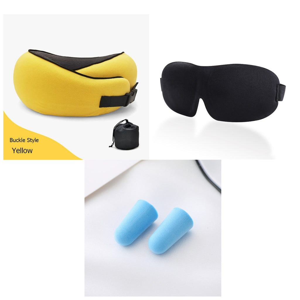 Yellow buckled travel pillow, black sleep mask, and blue earplugs on a white background.