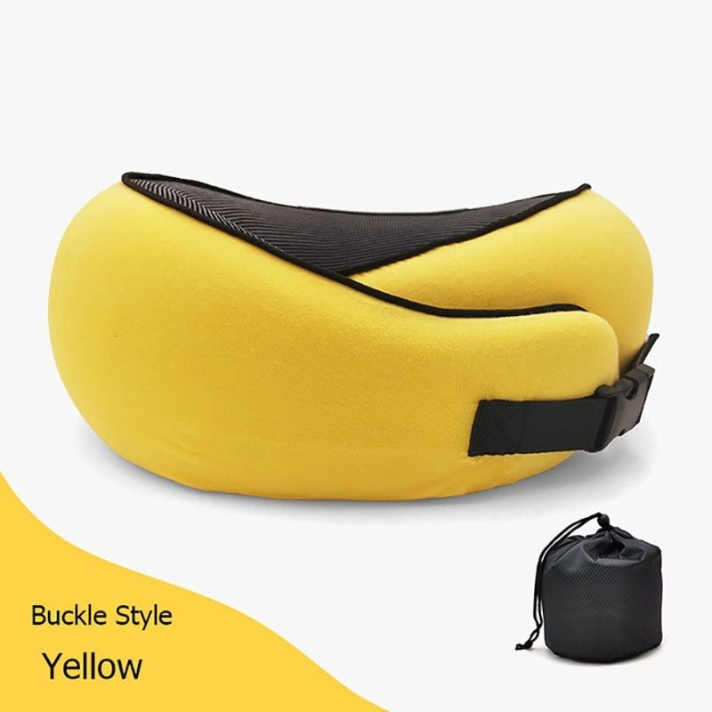 Yellow travel pillow with black strap on a white background
