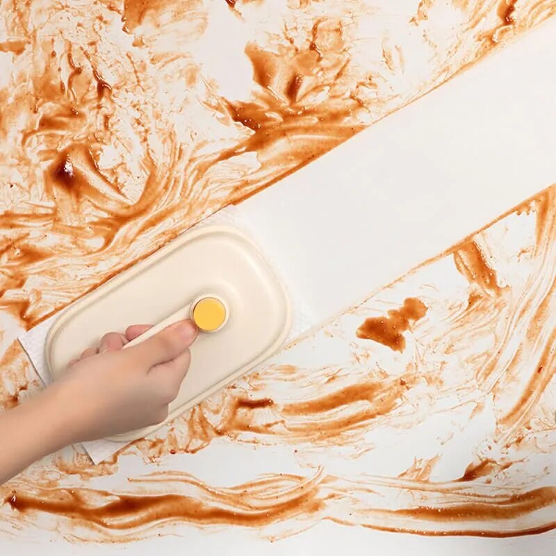 Hand using a handheld device on a marble surface with orange and white patterns