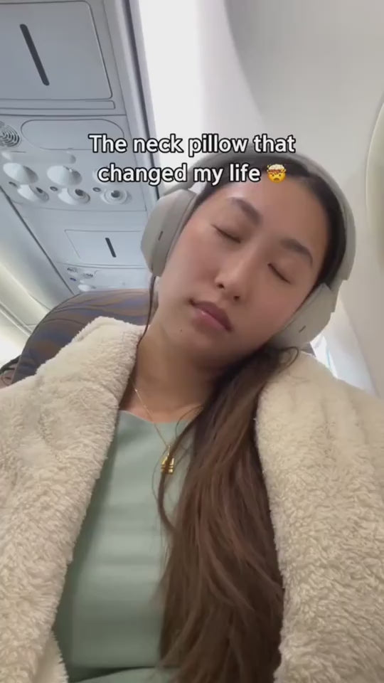 girl wearing neck pillow 